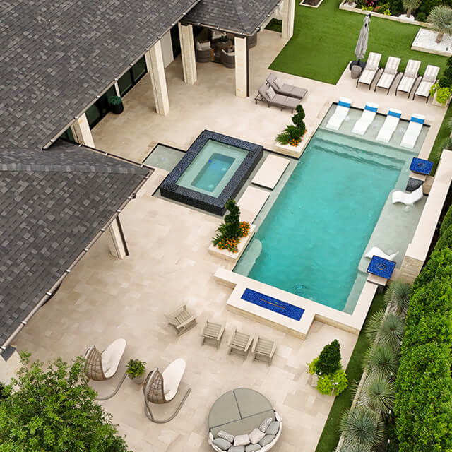 bmrpoolandpatio20 a pool and arbor at night